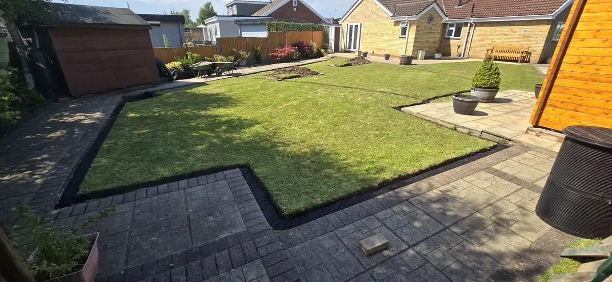 Garden with localised access excavations and surrounding paving