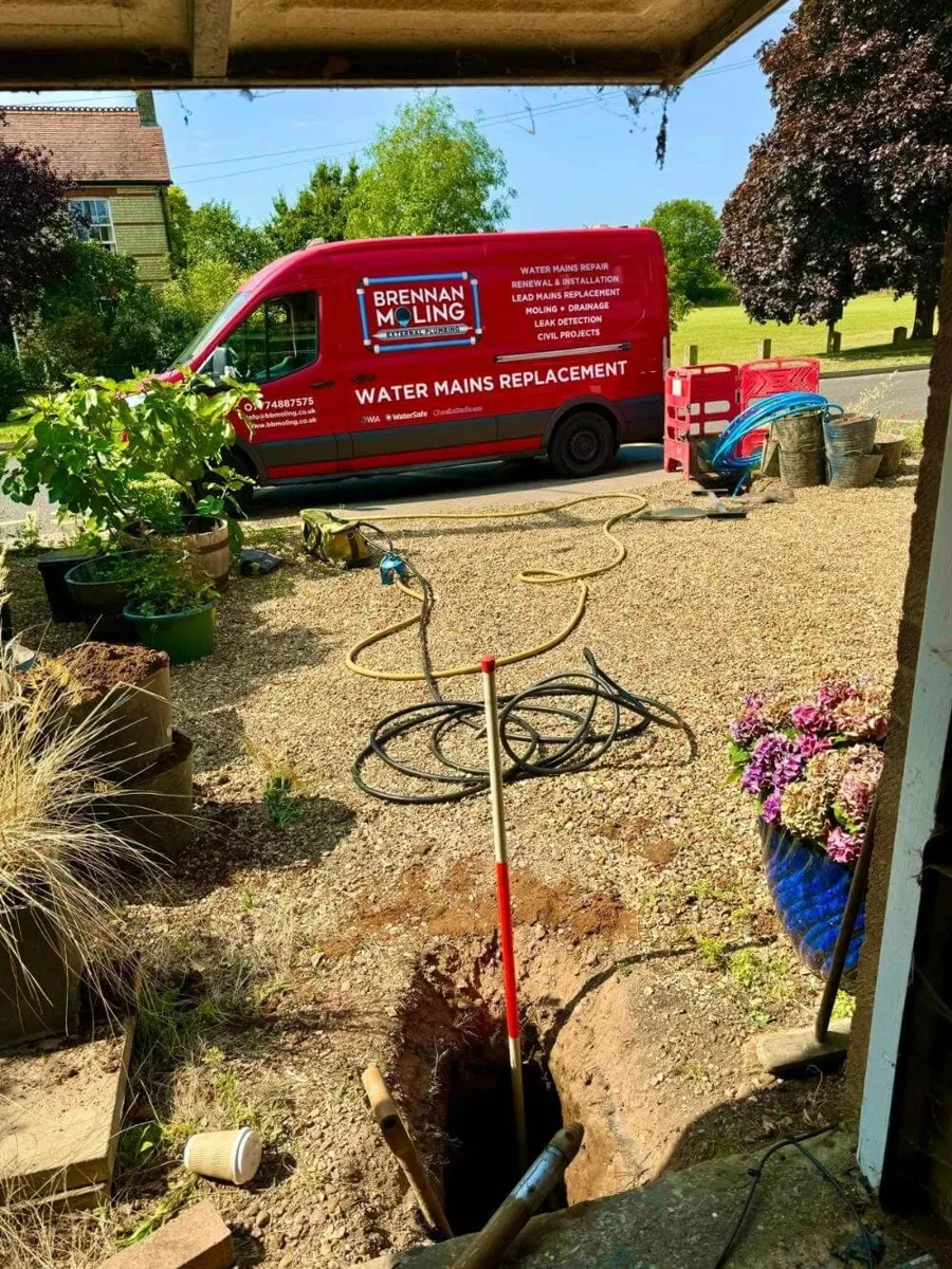 A supply-pipe excavation alongside Brennan’s vehicle and equipment.