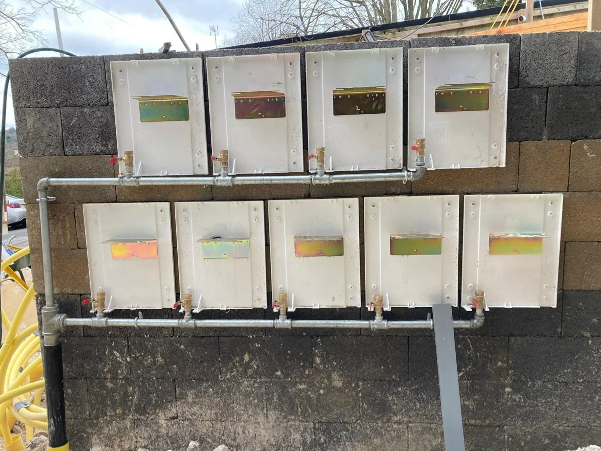Multiple service boxes mounted in an external work area.