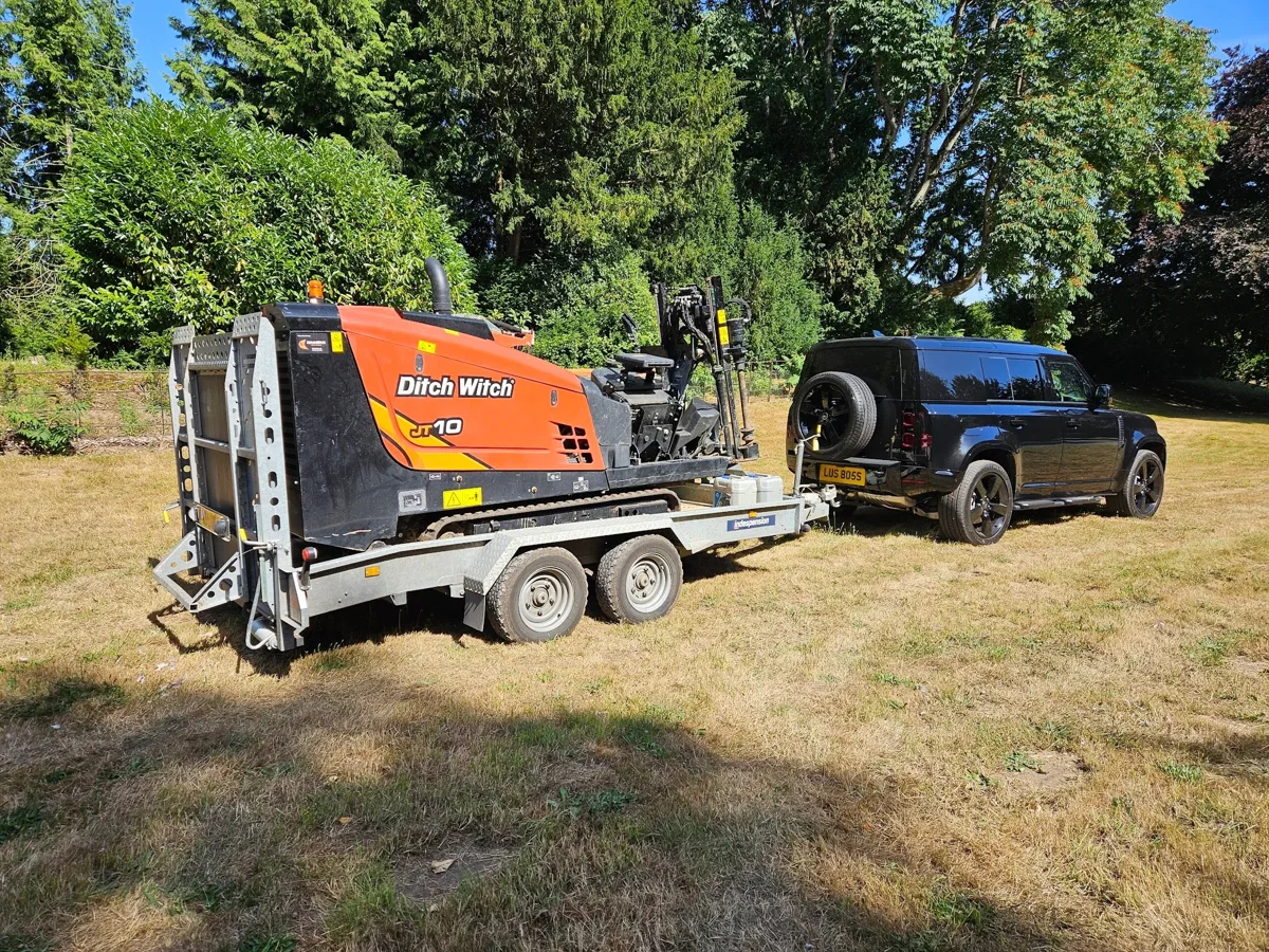 A directional drilling rig on a trailer with its towing vehicle.