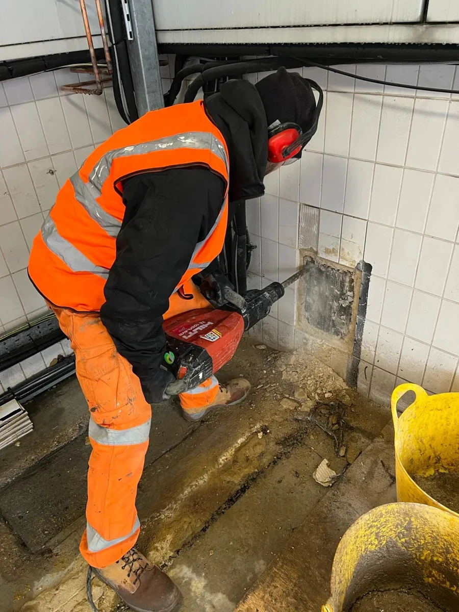 A Lucking engineer working on the internal pipe entry area.