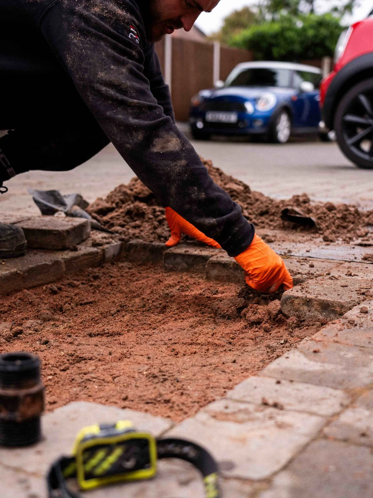 Picot engineer carefully reinstating block paving